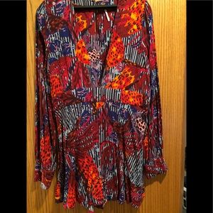 Free People Romper. Beautiful colors and like new.